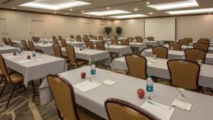 a conference room with white tables and chairs at Holiday Inn Denver Lakewood by IHG in Lakewood