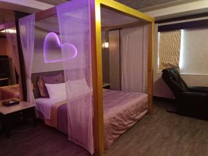 Divstāvu gulta vai divstāvu gultas numurā naktsmītnē Xin Yuan Motel