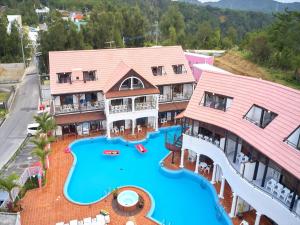 an aerial view of a resort with a water park at Private Villa Espacio Onna in Inbu