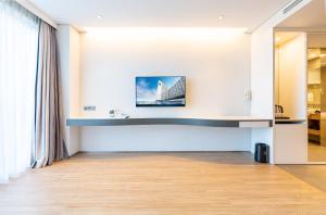 TV a/nebo společenská místnost v ubytování Hotel Whistlelark Jeju