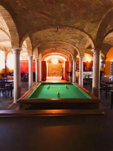 a pool table in the middle of a building at Albergo Villa Francesca Beauty Spa in Calvisano