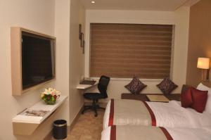 Postel nebo postele na pokoji v ubytování Days Hotel Jaipur Tonk Road By Wyndham