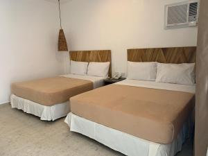 Rúm í herbergi á Cebu R Resort Tabuelan