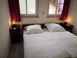 Posteľ alebo postele v izbe v ubytovaní Haus der Harmonie