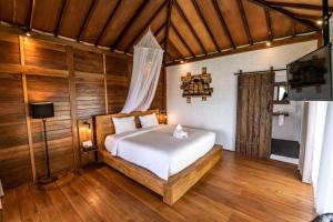 Postel nebo postele na pokoji v ubytování Bali De Pardis Cottage