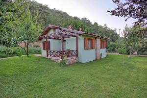 a small house in a field with a grass yard at Dalya Life in Göcek