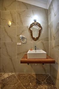 a bathroom with a sink and a mirror at Dalya Life in Göcek