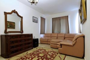 a living room with a couch and a mirror at Dalya Life in Göcek