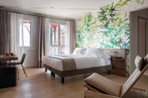 Postel nebo postele na pokoji v ubytování QC Room San Pellegrino