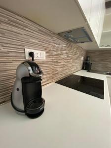 a coffee maker sitting on a kitchen counter at Greta's House Pizzo in Pizzo