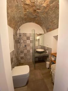 a bathroom with a shower and a toilet and a sink at Greta's House Pizzo in Pizzo +10 photos