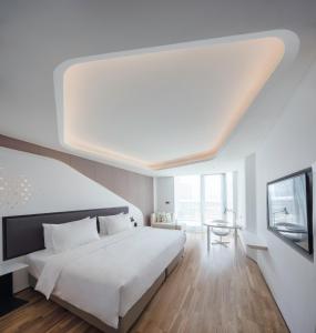 Postel nebo postele na pokoji v ubytování FlyZoo Hotel - Alibaba Future Hotel