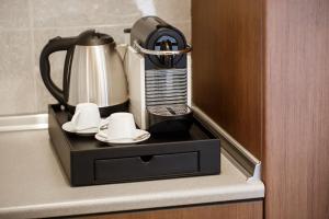 a coffee maker sitting on top of a counter at Melon Suites in Thessaloniki