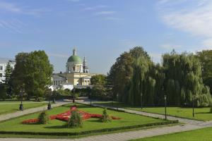 a park with a building in the background at Danilovskaya Hotel in Moscow