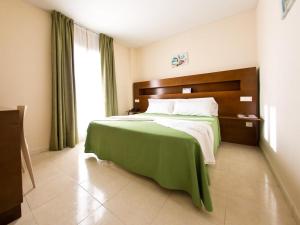 A bed or beds in a room at Hostal San Marcos