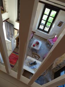 an overhead view of a living room with a table at Muse Neate in Halki