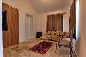a living room with a couch and a table at Dalya Life in Göcek