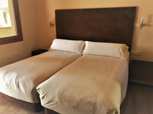 Postel nebo postele na pokoji v ubytování Chillout Hotel Tres Mares