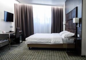 Postel nebo postele na pokoji v ubytování Park Hotel