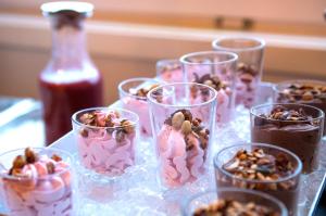 a group of glasses filled with ice cream and nuts at Narvik Budget Rooms in Narvik