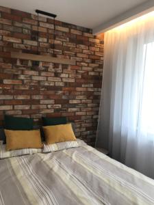 Posteľ alebo postele v izbe v ubytovaní Apartament Bojary
