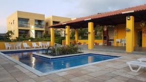 a swimming pool in front of a building at flat em serra negra - bezerros in Bezerros +113 photos