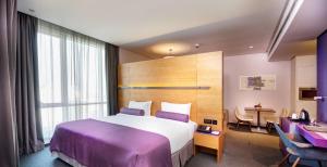 Letto o letti in una camera di The Act Hotel Sharjah