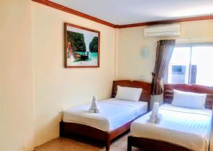 Tempat tidur dalam kamar di Golden Bee PhiPhi