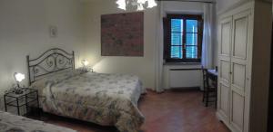 Ένα ή περισσότερα κρεβάτια σε δωμάτιο στο Agriturismo Isola Verde