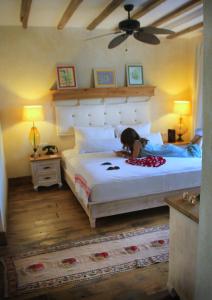 a person laying on a bed in a bedroom at Hotel Unique-Boutique Class - Adults Only in Fethiye