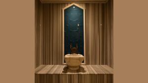 a vase on a table in a room with a window at Hotel Unique-Boutique Class - Adults Only in Fethiye
