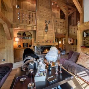 a living room with a couch and a fireplace at Beautiful Nirvana in Megève