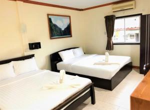 Tempat tidur dalam kamar di Golden Bee PhiPhi