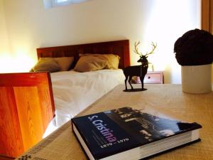 A bed or beds in a room at La terrazza gardenese