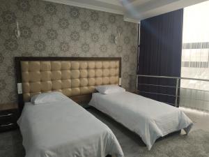 מיטה או מיטות בחדר ב-Турист
