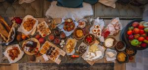 a table with a bunch of different types of food at Amymone Suites in Nafplio