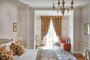 a bedroom with a bed and a living room at Splendido, A Belmond Hotel, Portofino in Portofino