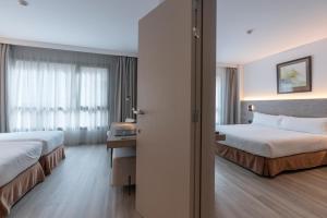 Ein Bett oder Betten in einem Zimmer der Unterkunft Attica 21 Barcelona Mar