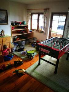 a room with a table with toys on the floor at Ortnerhof in Millstatt