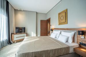 Posteľ alebo postele v izbe v ubytovaní Hotel Tonanti