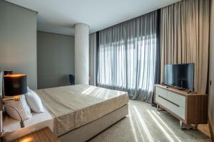 Posteľ alebo postele v izbe v ubytovaní Hotel Tonanti
