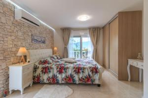 Postel nebo postele na pokoji v ubytování Anastasia Residence Sea View
