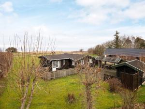 een luchtfoto van een huis in een veld bij 6 person holiday home in Grenaa in Grenå
