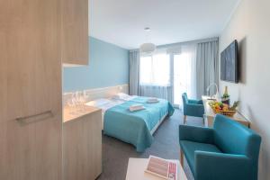 Posteľ alebo postele v izbe v ubytovaní Apartamenty Nad Parsętą Szpitalna 7