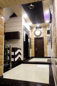 a large room with a hallway with a door and a room with at Hotel Raj Inn Ajmer Sharif in Ajmer