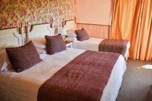 Postel nebo postele na pokoji v ubytování Hotel & Apart Hotel Monte Verde