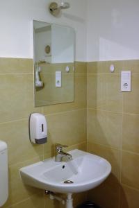 Koupelna v ubytování Green Lake Airport Apartments + 37 fotografií