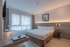 Ein Bett oder Betten in einem Zimmer der Unterkunft Attica 21 Barcelona Mar