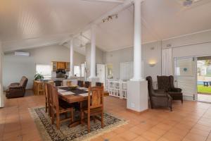 a dining room and kitchen with a table and chairs at Comp Beach Road 25 - FAMILY ONLY in Ballito