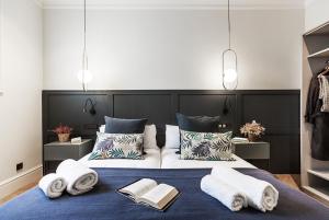 A bed or beds in a room at Weflating City Center